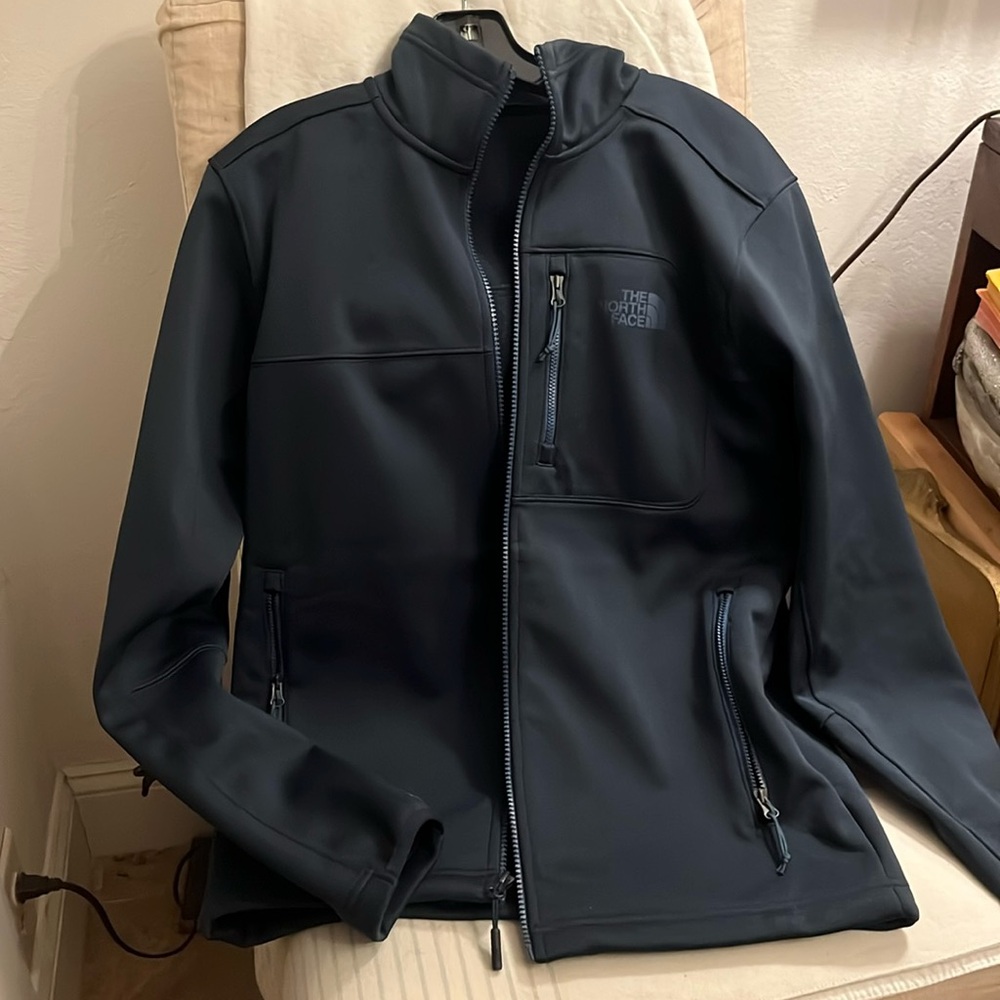 Dark gray/blue North Face jacket
